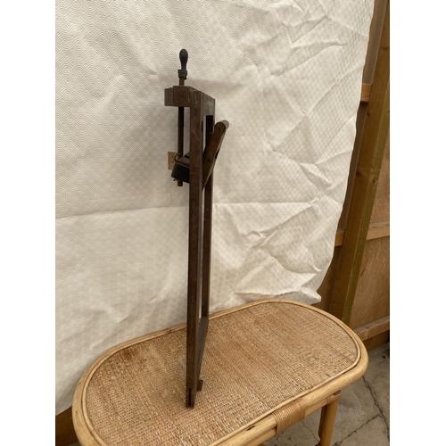 1202 - A VINTAGE WOODEN WIND OUT STAND