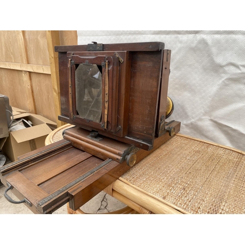 1203 - A VINTAGE CAMERA WITH LENS AND HEIGHT ADJUSTABLE STAND