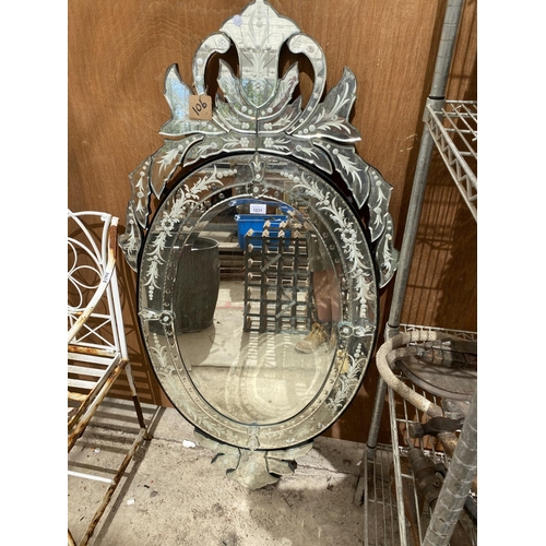 1231 - A LARGE DECORATIVE OVAL VENETIAN WALL MIRROR