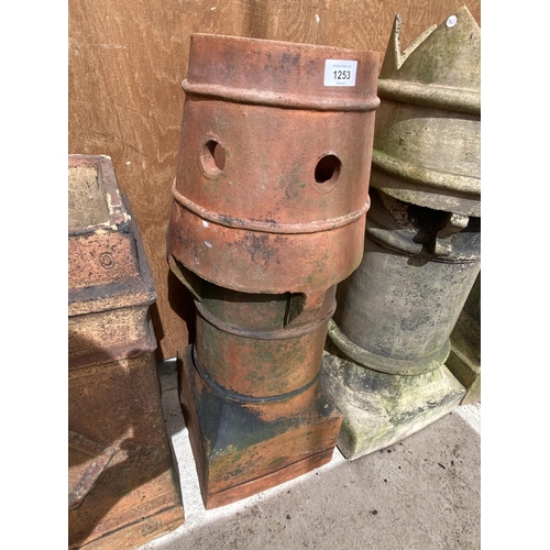 1253 - A PAIR OF DECORATIVE CHIMNEY POTS