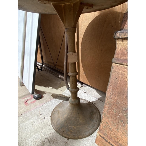 1254 - A RED FORMICA TOPPED BAR TABLE WITH A HEAVY CIRCULAR BASE