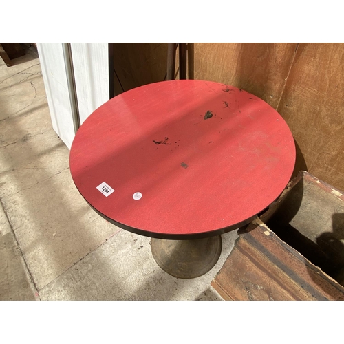 1254 - A RED FORMICA TOPPED BAR TABLE WITH A HEAVY CIRCULAR BASE