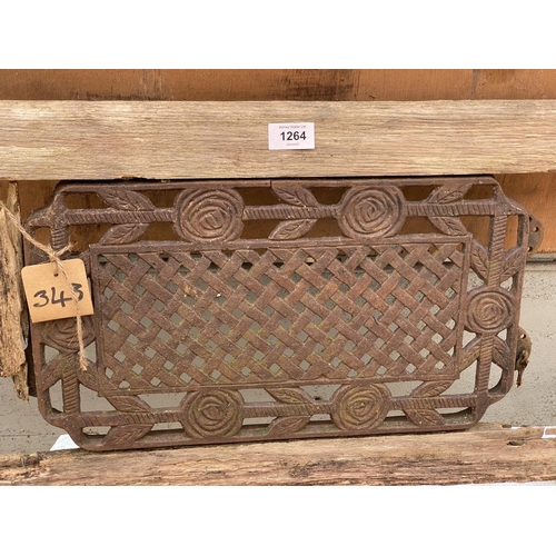 1264 - A WOODEN SLATTED GARDEN BENCH WITH CAST IRON BENCH ENDS