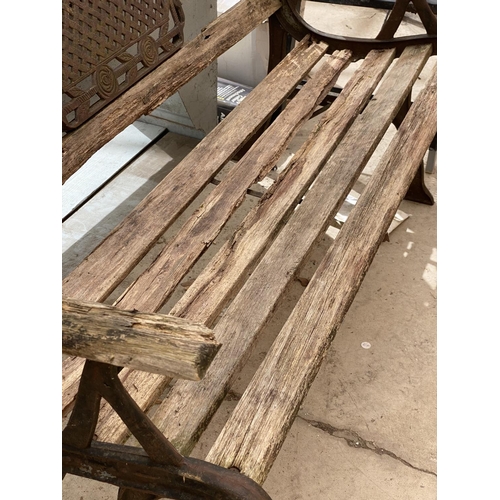 1264 - A WOODEN SLATTED GARDEN BENCH WITH CAST IRON BENCH ENDS