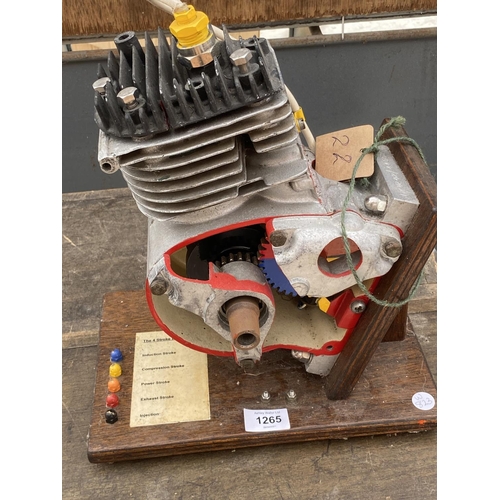 1265 - A MODEL OF A FOUR STROKE ENGINE ON A WOODEN PLINTH