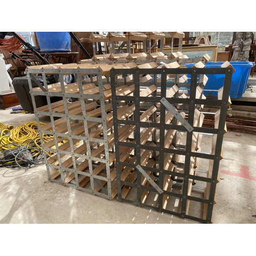 1281 - A SET OF FOUR STACKING METAL AND WOODEN WINE RACKS