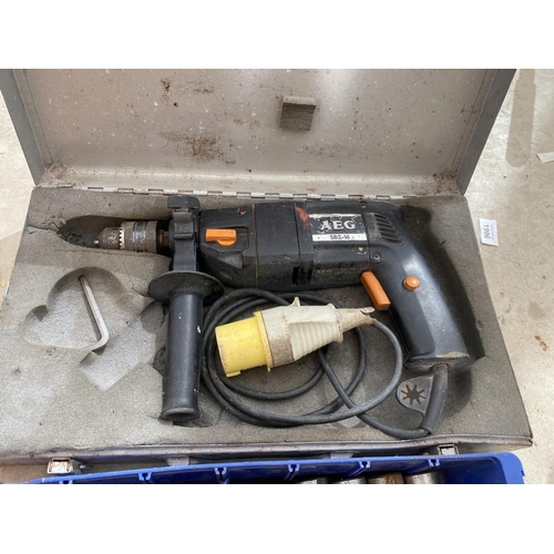 1292 - AN AEG ELECTRIC DRILL AND A QUANTITY OF DRILL BITS