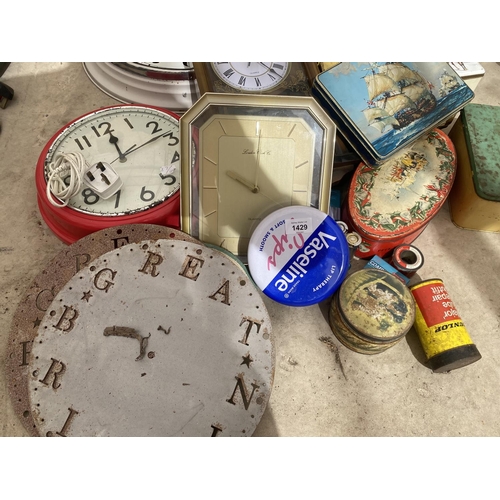 1429 - A LARGE ASSORTMENT OF VINTAGE TINS AND CLOCKS ETC