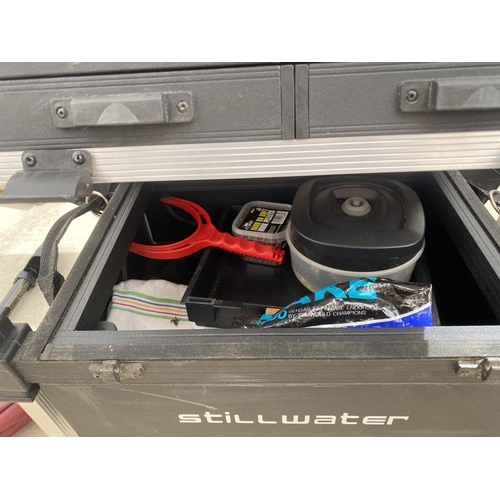 1510 - A STILLWATER TACKLE BOX AND SEAT WITH REALS, FLOATS BAIT SLINGERS ETC