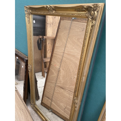 1611 - A DECORATIVE GILT FRAMED MIRROR AND A FURTHER WOODEN FRAMED MIRROR