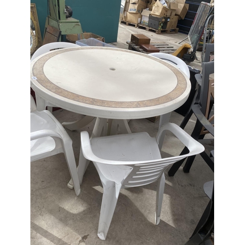 1616 - A ROUND PLASTIC GARDEN TABLE WITH 4 CHAIRS