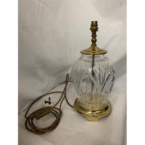 107 - A LARGE GLASS TABLE LAMP WITH BRASS DETAIL H: 38CM