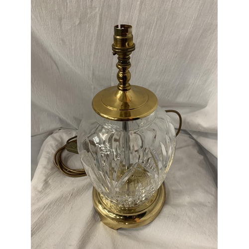 107 - A LARGE GLASS TABLE LAMP WITH BRASS DETAIL H: 38CM