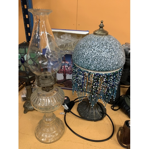 124 - A BOXED TIFFANY LAMP, A BEADED ART NOUVEAU DOMED LAMP AND A GLASS OIL LAMP