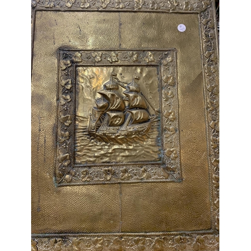 388 - A BRASS FIRE SCREEN DEPICTING A SAILING SHIP