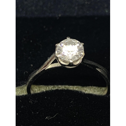 516 - A 9 CARAT WHITE GOLD SOLITAIRE RING