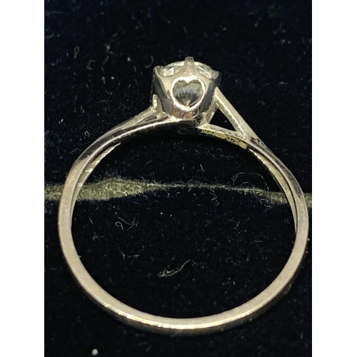 516 - A 9 CARAT WHITE GOLD SOLITAIRE RING