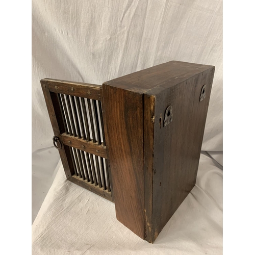 71 - A STAINED OAK KEY CABINET WITH METAL SLAT DETAIL 21.5CM X 32CM