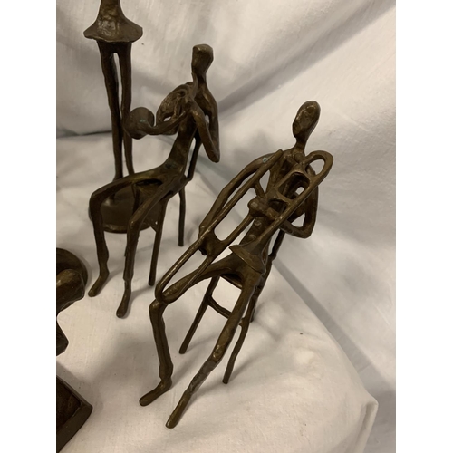 81 - A GROUP OF TEN BRONZE FIGURINES IN THE ABSTRACT FORM