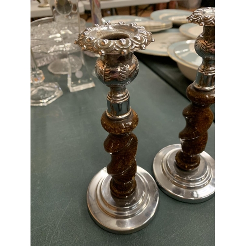 85 - A PAIR OF OAK BARLEY TWIST CANDLESTICKS WITH WHITE METAL DETAIL H:22CM