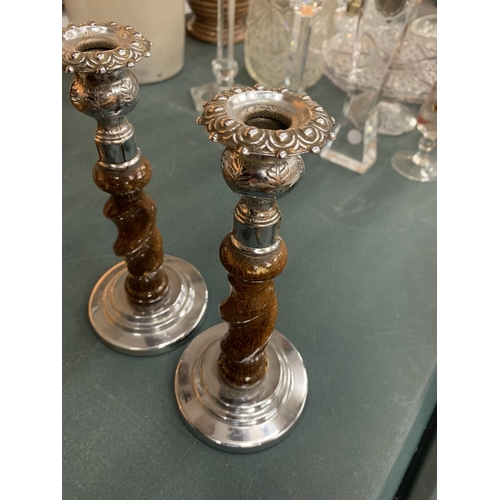 85 - A PAIR OF OAK BARLEY TWIST CANDLESTICKS WITH WHITE METAL DETAIL H:22CM