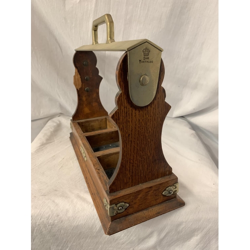 92 - A VINTAGE OAK 'THE TANTALUS' BOTTLE CARRIER WITH BRASS DETAIL