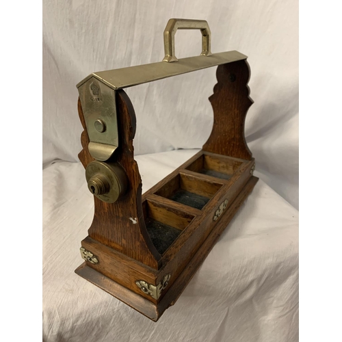 92 - A VINTAGE OAK 'THE TANTALUS' BOTTLE CARRIER WITH BRASS DETAIL