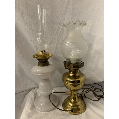 95 - TWO OIL LAMPS, ONE WITH A WHITE GLASS BASE AND THE OTHER A BRASS EXAMPLE