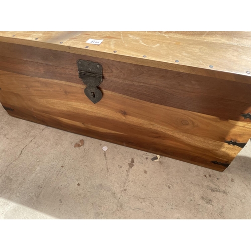 2104 - A MODERN HARDWOOD TRUNK WITH METAL STUDS