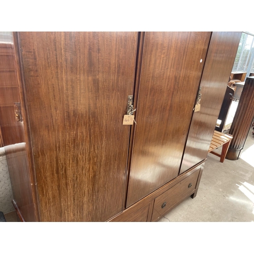 2121 - AN EARLY 20TH CENTURY MAHOGANY DOUBLE WARDROBE WITH TWO DRAWERS TO THE BASE AND INTERNAL MIRROR DOOR... 