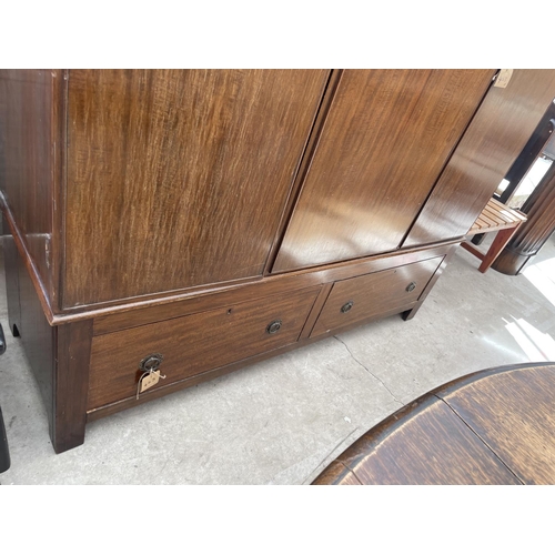 2121 - AN EARLY 20TH CENTURY MAHOGANY DOUBLE WARDROBE WITH TWO DRAWERS TO THE BASE AND INTERNAL MIRROR DOOR... 