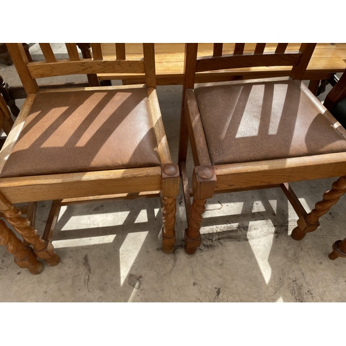 2134 - A SET OF FOUR EARLY 20TH CENTURY LIGHT OAK DINING CHAIRS ON BARLEYTWIST LEGS