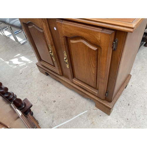 2142 - A MODERN TWO DOOR BOOKCASE ON BASE, WITH GLAZED LEADED UPPER PORTION AND CUPBOARDS BELOW, 40