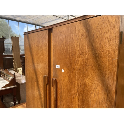 2151 - A RETRO TEAK TWO DOOR BEAUTILITY WARDROBE W: 36 INCHES