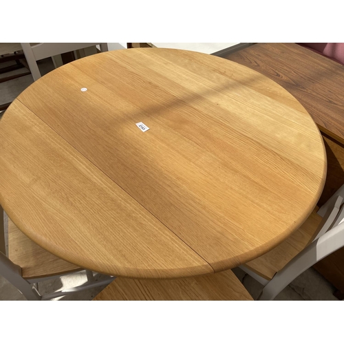 2163 - A MODERN CIRCULAR DROP LEAF DINING TABLE, 35