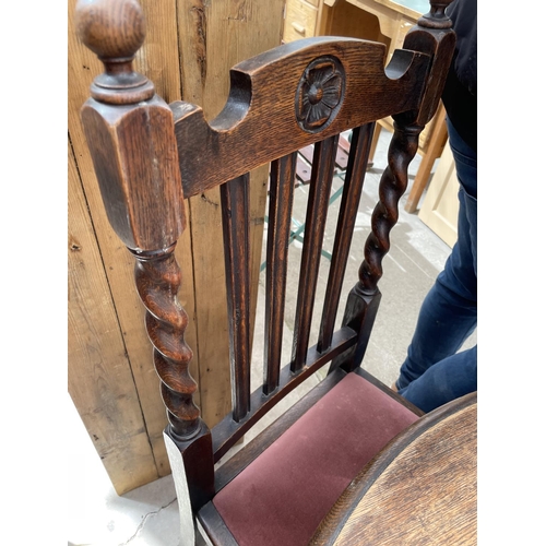 2168 - AN EARLY 20TH CENTURY OVAL OAK WIND-OUT DINING TABLE ON BARLEYTWIST LEGS, 54X41.5