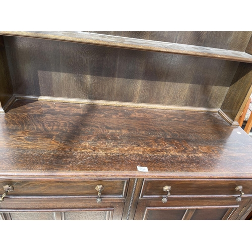 2186 - AN EARLY 20TH CENTURY OAK DRESSER ON SHORT TURNED LEGS, COMPLETE WITH PLATE RACK, 48