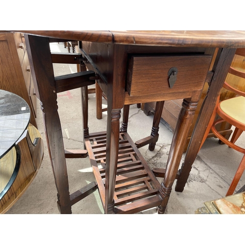 2188 - A 20TH CENTURY OVAL HARDWOOD GATELEG DINING TABLE, 36X34.5