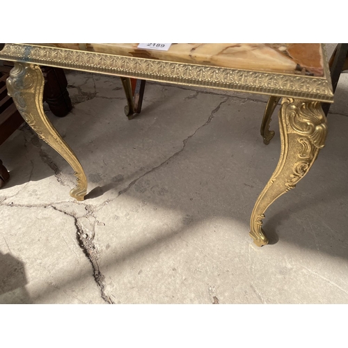 2189 - A MODERN BRASS FRAMED LOW TABLE WITH INSET RESIN TOP INCORPORATING DECORATIVE STONES, 17X13