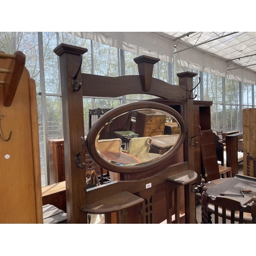 2206 - AN ART NOUVEAU OAK HALL STAND WITH SWING FRAME MIRROR