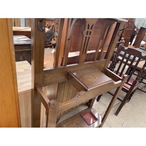 2206 - AN ART NOUVEAU OAK HALL STAND WITH SWING FRAME MIRROR