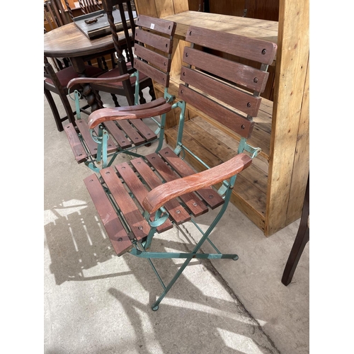 2207 - A PAIR OF FOLDING METALWARE GARDEN ELBOW CHAIRS