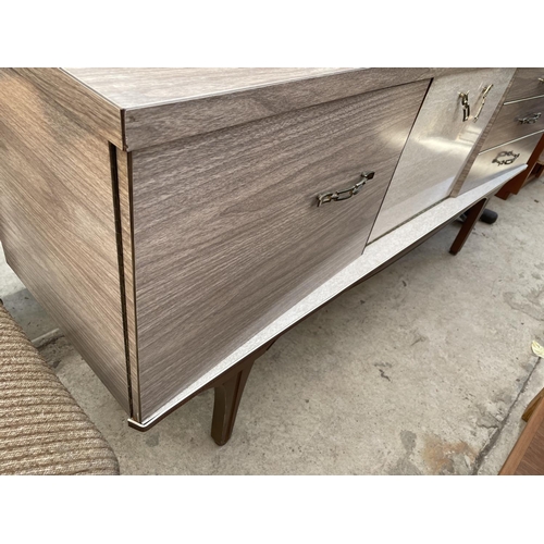 2226 - A 1970'S CREAMY WALNUT EFFECT SIDEBOARD ENCLOSING COCKTAIL SECTION, CUPBOARD AND THREE DRAWERS, 66