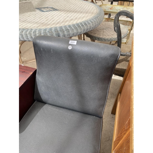 2251 - A BLACK LEATHER EFFECT FIRESIDE CHAIR