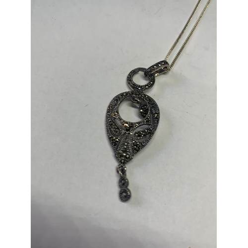 532 - THREE SILVER NECKLACES WITH MARCASITE STONE PENDANTS TO INCLUDE A HEART AND A CROSS ETC