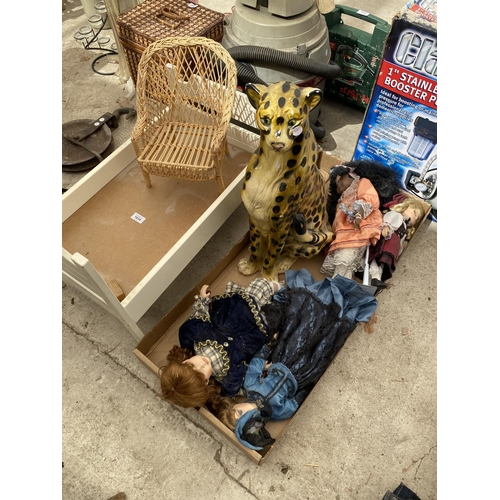 1634 - A DOLLS COT, AN ASSORTMENT OF DOOLS AND CERAMIC LEOPARD