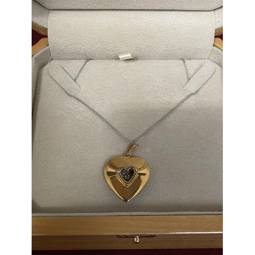 504 - A 15 CARAT WHITE AND YELLOW GOLD DIAMOND HEART CLUSTER PENDANT WITH CHAIN LENGTH 44CM