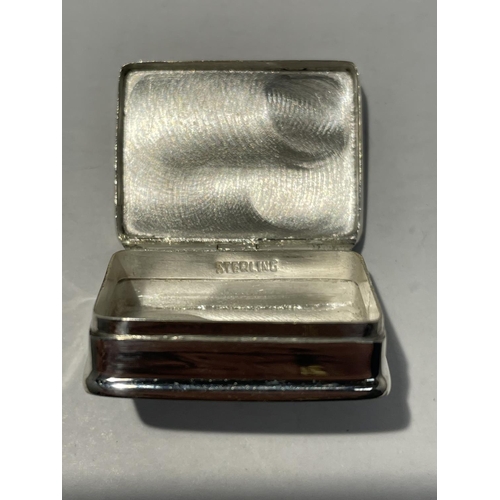 599 - A SILVER PILL BOX WITH AN ENAMEL EROTIC DESIGN ON THE LID