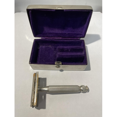 609 - A VINTAGE GILLETTE RAZOR IN A HAMMERED PEWTER BOX