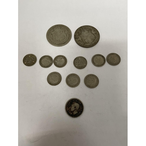 634 - TWELVE 1921 - 1946 SILVER COINS TO INCLUDE TWO FLORINS, A SIXPENCE, AND NINE THREE PENNIES